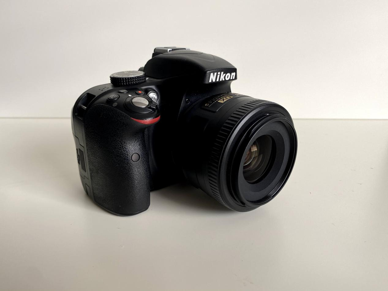A picture of my camera: a Nikon D3300 with a Nikon AF-S DX Nikkor 35mm f/1.8G prime lens.