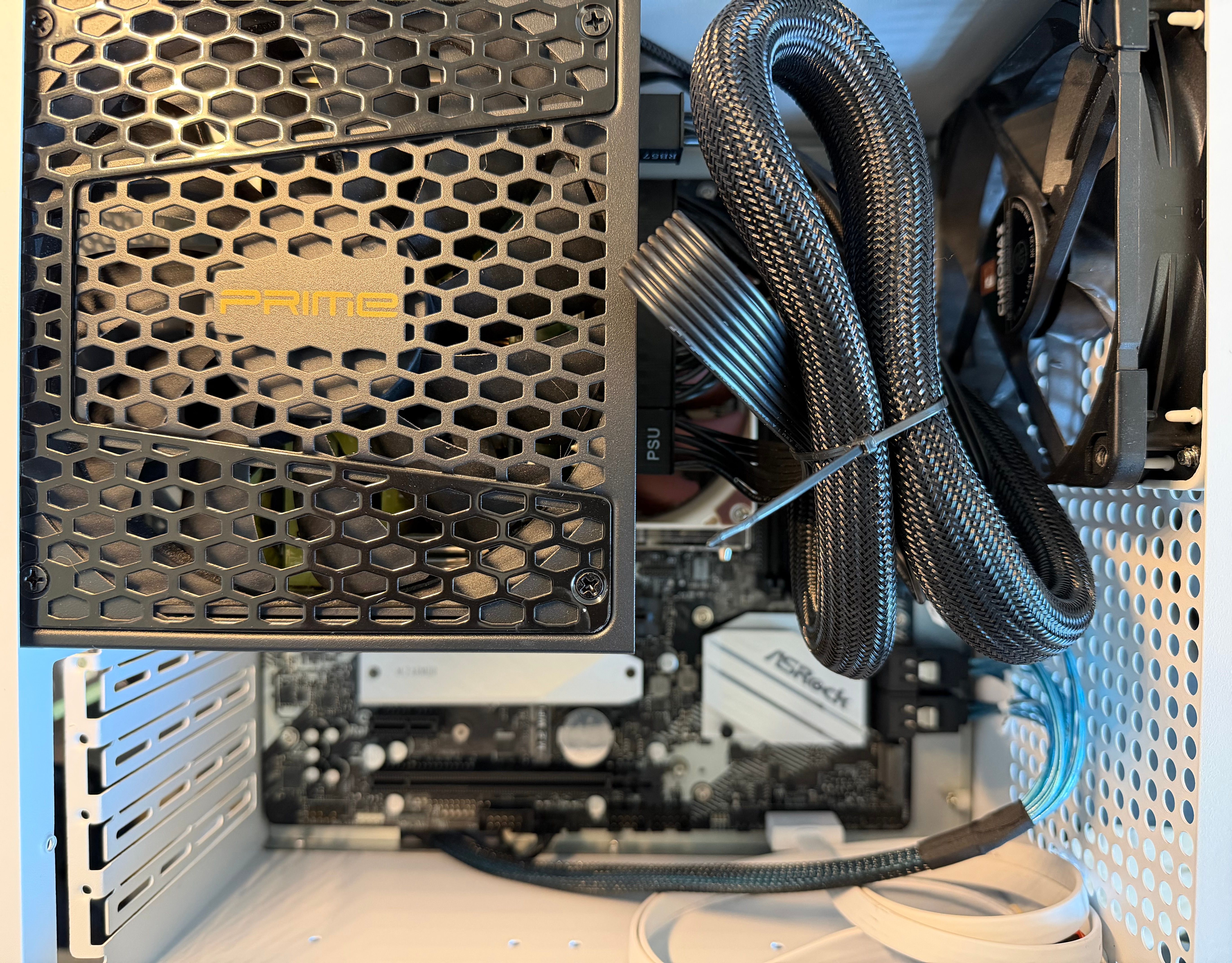 Interior of the NAS case showing the large SeaSonic power supply and its bundled cables above the motherboard.
